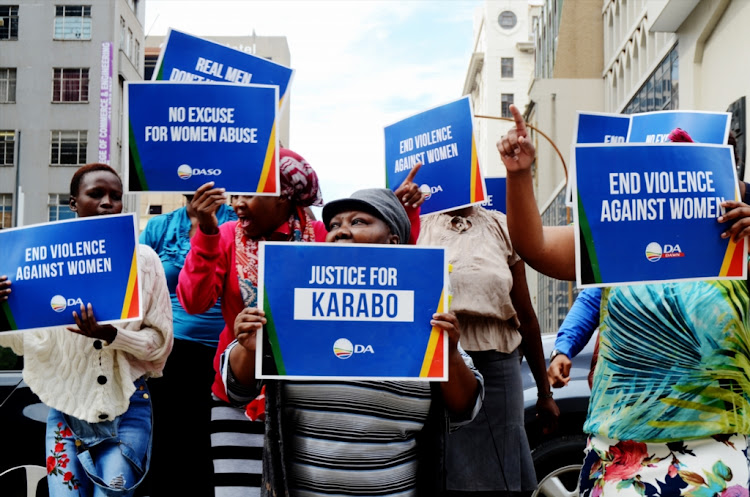 Supporters picket outside the high court demanding justice for Karabo Mokoena, the woman who was allegedly murdered by her boyfriend Sandile Mantsoe last year on March 19, 2018 in Johannesburg, South Africa.
