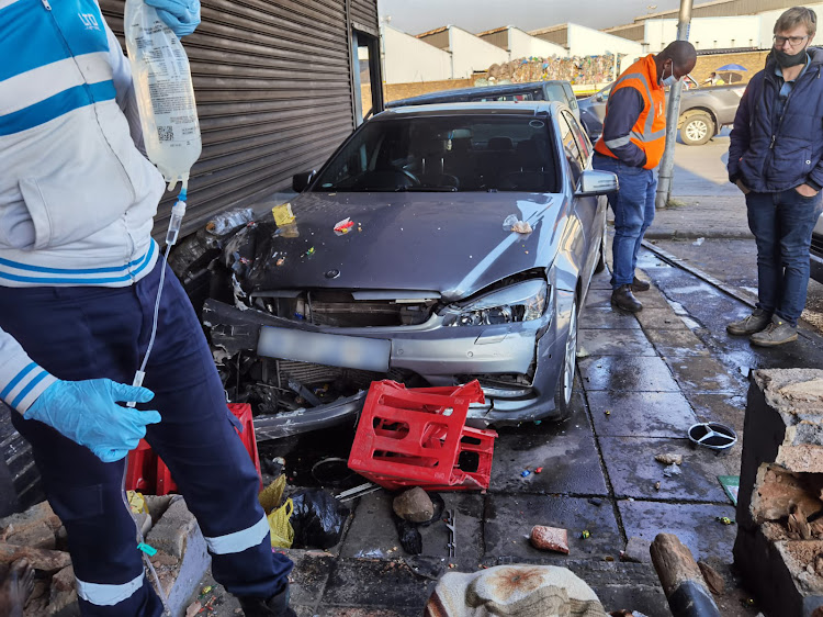 ER24 said the man had been opening his shop when he was struck by the vehicle.