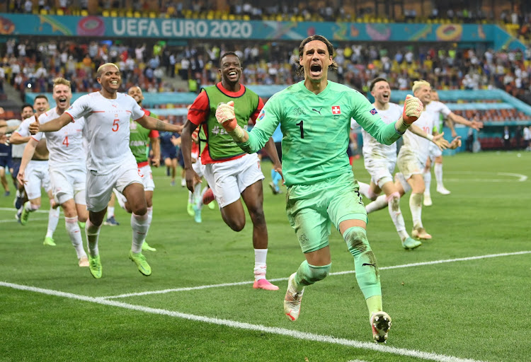 Switzerland goalkeeper Yann Sommer leads the celebrations after saving Kylian Mbappe's penalty to book his country a place in the Europena Championship quarterfinals.