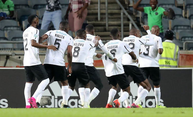Thembinkosi Lorch celebrates with teammates after scoring the winning goal.