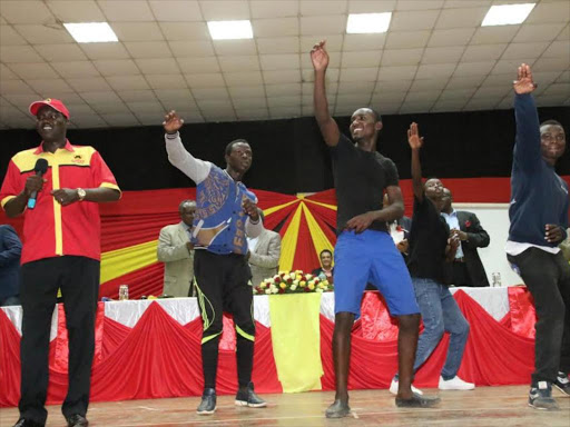 Uasin Gishu Governor Joseph Mandago dances with youths during a fundraiser for his re-election campaign, March 28, 2017. /MATHEWS NDANYI