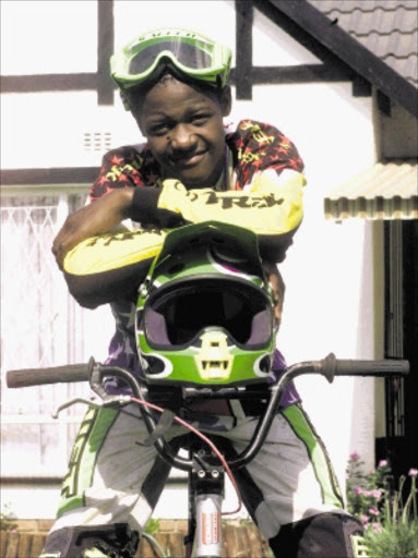 hot SHOT: National BMX champion Sifiso Nhlapo. Pic: WATSON MCOTELI. 11/02/2002. © Sowetan. SW20020111WMC002:SPORT:OTHER:11JAN2002 - 11012002WMC SPORT Sifiso Nhlapo, 14, won the South African National BMX Championship in his age group. PHOTO:WATSON MCOTELI