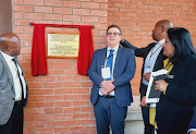 Officials unveiling a plaque at the official opening of the Chatsworth magistrate's court premises. 