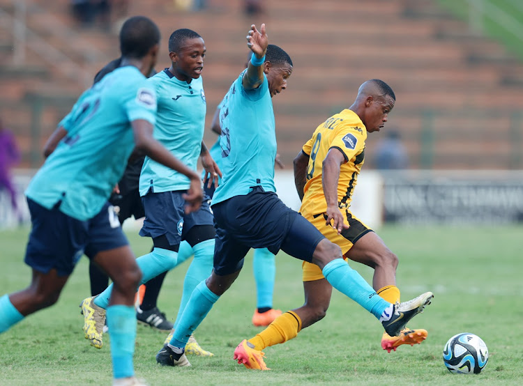 Ashley Du Preez of Kaizer Chiefs is challenged by Sibusiso Mthethwa and Moses Mthembu of Richards Bay FC in the DStv Premiership match at King Zwelithini Stadium in Umlazi, Durban, on Sunday.