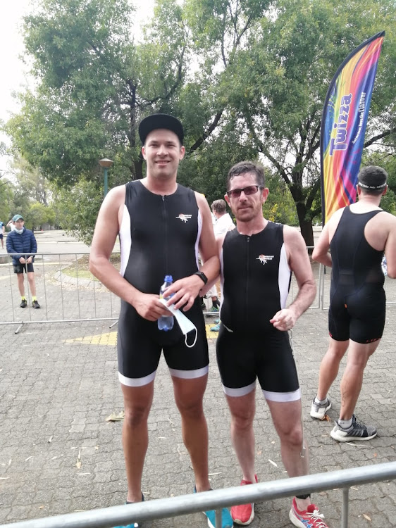 South African para triathlete Tim Stones, right, with guide Andrew Liddle, at the finish line of the South African Para Triathlon Championships, held in Maselspoort in April.