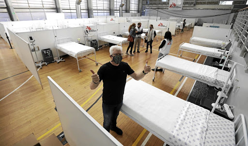 Western Cape Premier Alan Winde and Medecins Sans Frontieres officials visit Khayelitsha's Covid-19 field hospital, which has 68 beds on the basketball and netball courts of a community centre.