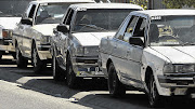 OLD FAITHFUL: Toyota Cressidas line up in Nyanga township to ferry passengers in Cape Town. Production of the car was halted in 1993, but taxi owners continue to take advantage of its durability