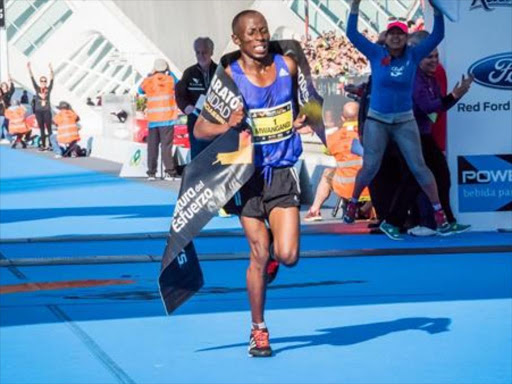 John Mwangangi after winning the 2015 Valencia Marathon. /COURTESY