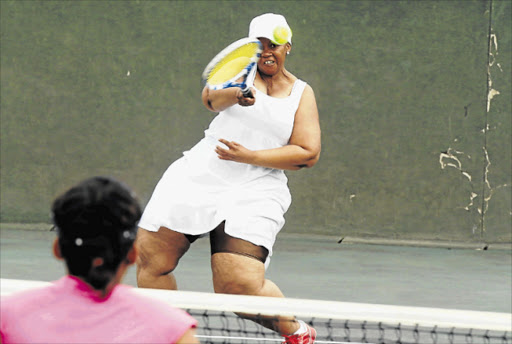 PULLING LOOSE: Hitting with all her power, Nwabisa Mningiswa of the OR Tambo Club delivers a return to her opponent during the clash against Buffalo City’s Destiny Club at the weekend Picture: MICHAEL PINYANA