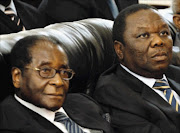 COMMITTED: Morgan Tsvangirai with Robert Mugabe  PHOTO: AFP