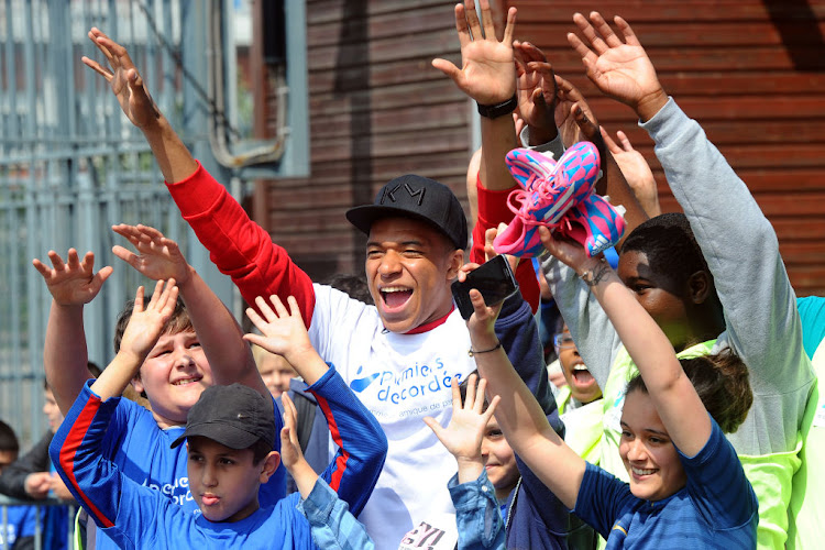 Footballer Kylian Mbappe takes part in the 'Tous En Bleu' sports workshops organised by the charity Premiers de Cordee Nearly 3,000 children from medical facilities were invited to the Stade de France for the 5th edition of 'La Journee de l' Evasion'.