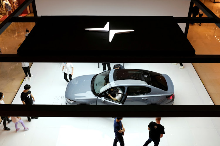 People look at a Polestar 2 electric sedan displayed in a shopping mall in Shanghai, China. File photo: REUTERS/YILEI SUN