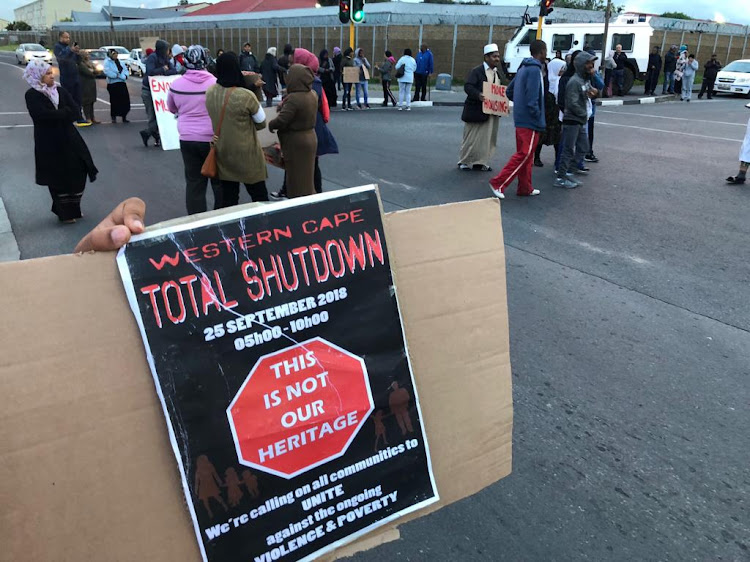 Residents of Hanover Park block Hanover Park Avenue at the start of a "total shutdown" in Cape Town.