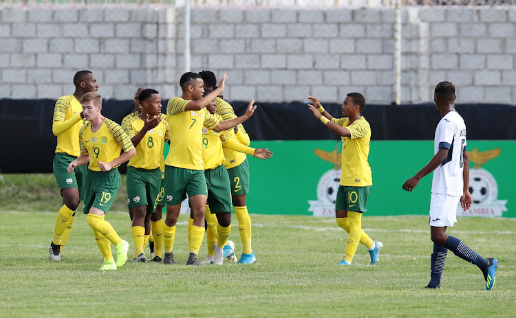 Sinenjongo Mkiva of South Africa celebrates a goal with teammates.