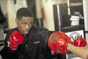 LOTS TO PROVE: IBO featherweight champion Lusanda Komanisi could find himself the subject of criticism
    
      Photo: Veli Nhlapo