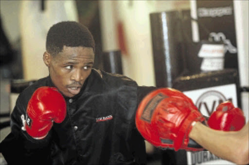 LOTS TO PROVE: IBO featherweight champion Lusanda Komanisi could find himself the subject of criticism Photo: Veli Nhlapo