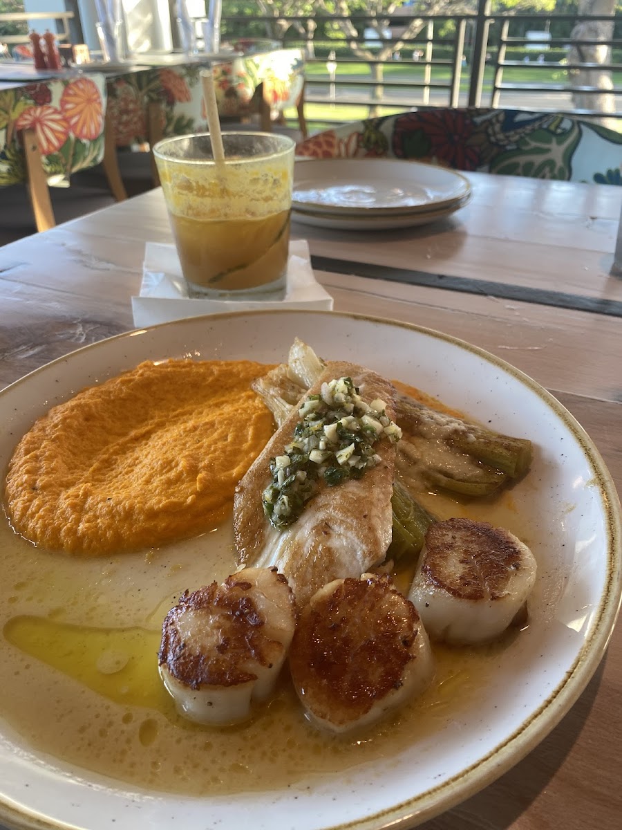 Fish, scallops, carrot and ginger purée and bok choy with a mai tai