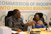 Gauteng premier , Panyaza Lesufi and Justice Sisi Khampepe during the officially hand over of the Usindiso  Building Commission of Inquiry in Midrand , Johannesburg. 