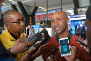 Amajita coach Thabo Senong with players during the South African U/20 MenÕs national team departure from OR Tambo International Airport on February 24, 2017 in Johannesburg, South Africa.
