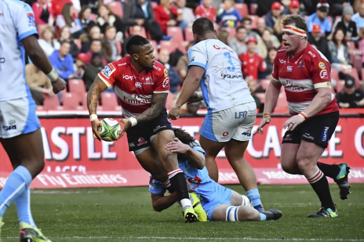 Elton Jantjies, Jacques van Rooyen (R) of the Lions during the Super Rugby match between Emirates Lions and Vodacom Bulls at Emirates Airline Park on July 14, 2018 in Johannesburg, South Africa.