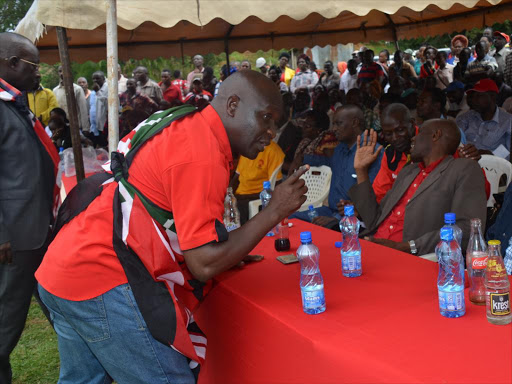 Trans Nzoia governor hopeful Kakai Bisau whispering a word to Endebes mp Robert Pukose in Kitale on Saturday