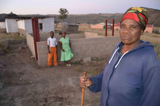 UNFINISHED BUSINESS: Mabhovu Moyana, 70, in front of her unfinished RDP house in Nkwazini village outside Mount Frere Picture: LOYISO MPALANTSHANE