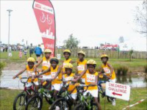 BIKE BRIGADE: Children from the Sparrows Rainbow Village prepare to set off on the Pick 'n Pay-94.7 Children's Cycle Challenge on bikes given to them by Sowetan. © Sowetan.