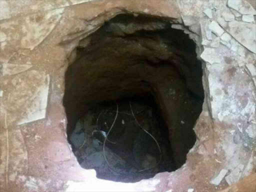 Part of the tunnel thieves dug under KCB's Thika branch before stealing Sh50 million, November 20, 2017. /JAMES WAINAINA