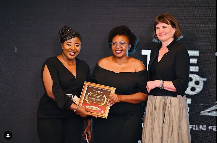 Producer Clementina Kabutha and director Cecimercy Wanza hold the Jury Award for Education on October 15 as Czech Ambassador Nicol Adamcova looks on