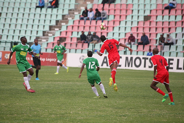 FILE IMAGE: A Super Eagles player, in green, controls the ball during their ABC Motsepe final clash with Uthongathi played at Buffalo City Stadium.