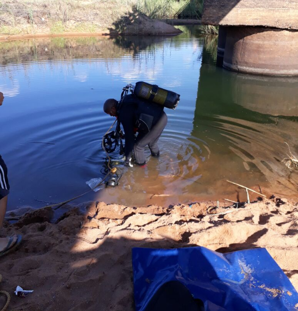 Rescue workers recover the body of a man who drowned while on a fishing trip at the Mogol River near Lephalale.