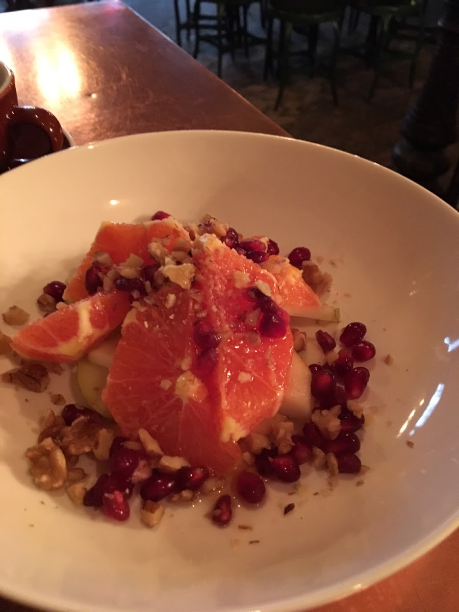 Delicious fruit with walnuts (grapefruit, pears, pomegranate and walnuts)