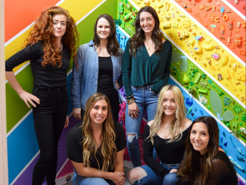 A group of people posing for a photo

Description automatically generated