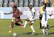 HAMSTRUNG: Lerato Chabangu avoids a tackle as Jabulani Nene of Chippa attempts to clear  the ball during the Absa Premiership match between  Swallows and Chippa United in Dobsonville Photo: Duif du Toit/Gallo Images