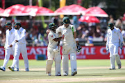 Temba Bavuma of South Africa and South African captain Faf du Plessis congratulate each other for reaching tea during day 2 of the 2nd Castle Lager Test match between South Africa and Pakistan at PPC Newlands on January 04, 2019 in Cape Town, South Africa. 