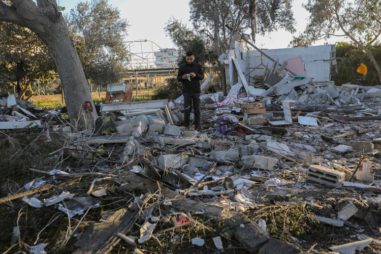 People inspect damage and recover items from their homes after Israeli air strikes in Rafah, Gaza, last week.