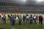 Crowd violence during the Nedbank Cup semifinal match between Kaizer Chiefs and Free State Stars at Moses Mabhida Stadium on Saturday in Durban. 
