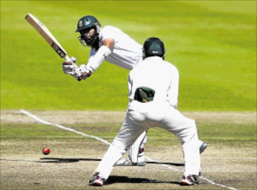ROCK-SOLID: Proteas batsman Hashim Amla scored his 20th test match century for South Africa as he anchored a faltering innings on the first day of the test against Pakistan in Abu Dhabi yesterday. Photo: Shaun Roy/Gallo Images/Getty Images