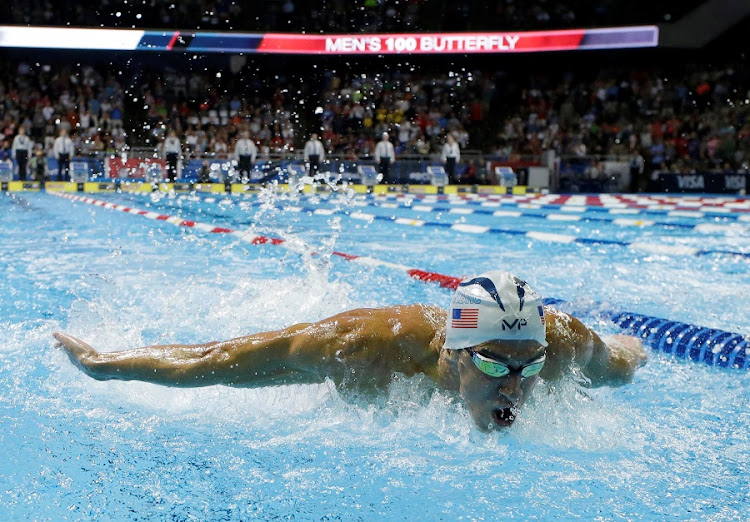 FREQUENT FLYER: Michael Phelps, who has 22 Olympic medals in total, during the 100m butterfly finals at the recent US trials. Picture: ROB SCHUMACHER/USA TODAY