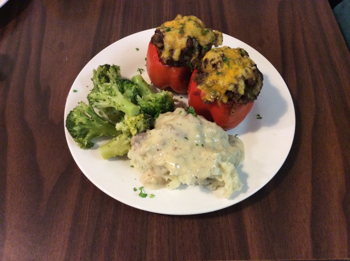 Stuffed sweet red bell peppers and real mashed potatoes broccoli