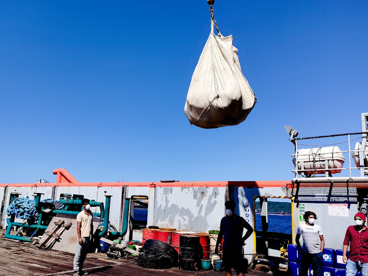 Abandoned sailors in Durban harbour welcome an emergency food drop from the SA Maritime Safety Authority.