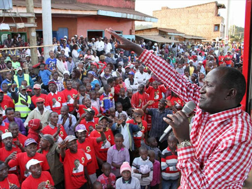 Kigumo MP Jamleck Kamau addressing Kiharu residents on Sunday. Photo/WILLIAM MWANGI