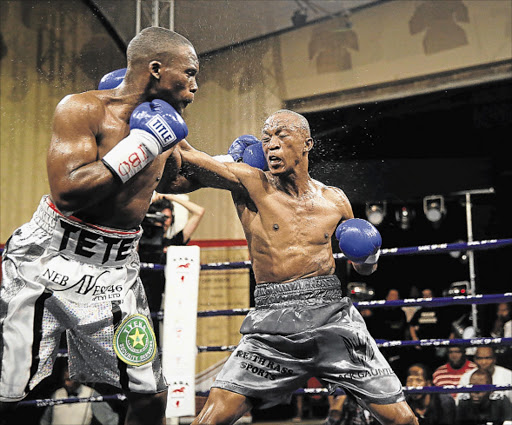 BLOW BY BLOW: Makazole Tete, left and Gideon Buthelezi exchange jabs in their fight at the Orient Theatre recently Picture: MARK ANDREWS
