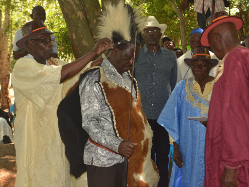 Cord leader Raila Odinga is crowned a Luo elder at Got Ramogi on Saturday/EMMANUEL WANSON