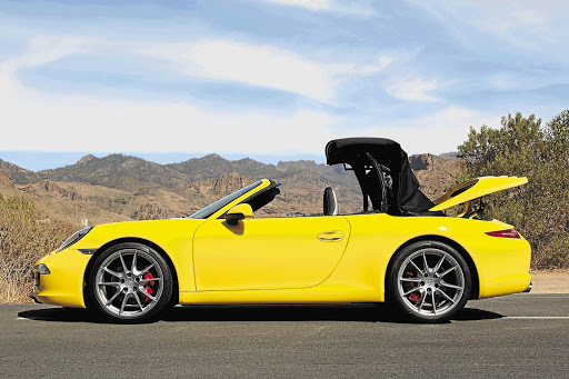 The roof of the Porsche 911 Carrera Cabriolet retracts at the push a button