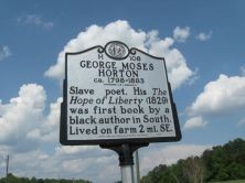 Slave poet. His The Hope of Liberty (1829) was first book by a black author in South. Lived on farm 2 mi. SE.Plaque via North Carolina Highway Historical Marker Program, and is used with their...