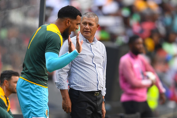 Kaizer Chiefs reserve goalkeeper Brandon Petersen exhanges words with coach Cavin Johnson during the DStv Premiership Soweto derby against Orlando Pirates at FNB Stadium on Saturday.