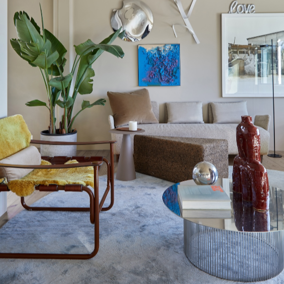 Sectional sofas from Piér Rabe Antiques make the living area ideal for ultra-relaxed lounging. The artworks on the wall include a metal sculpture by salvage artist Philippe Bousquet and a photograph by Anton De Sousa Costa.