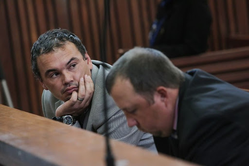 From left: Willem Oosthuizen and Theo Jacobs appear at the High Court sitting at the Middleburg Magistrates court in Mpumalanga ahead of sentencing proceedings. The pair have been convicted of assault after forcing Victor Mlotshwa into a coffin and threatening to set him alight. Picture: Alaister Russell/The Times