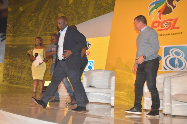 Mamelodi Sundowns head coach Pitso Mosimane leaves the stage along with his Bidvest Wits counterpart Gavin Hunt during the 2017 MTN8 launch at The Galleria in Johannesburg, South Africa. (
